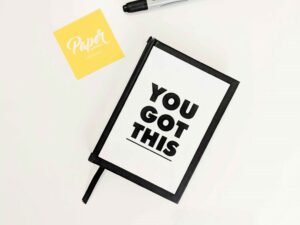 A notebook with affirmations of self-love, it says "you got this"