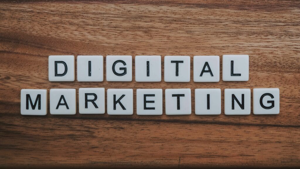 letter tiles on a desk that spell digital marketing